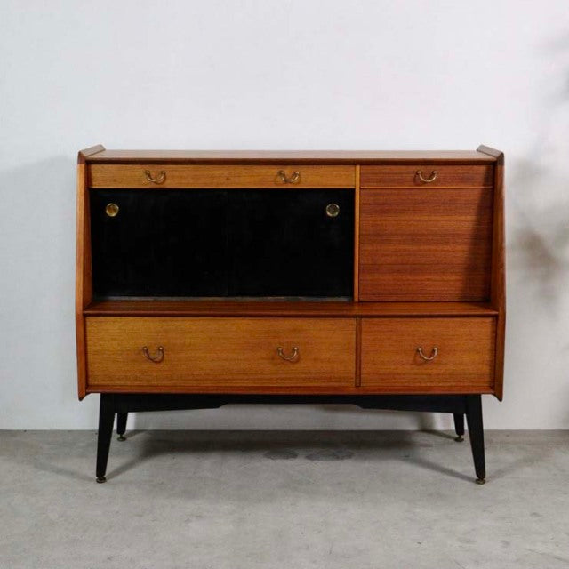 Mid-century British vintage G-Plan LIBRENZA highboard in teak with black drop-down door, brass handles, and tapered black.