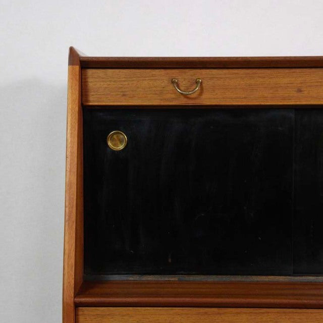 Vintage mid-century G-Plan LIBRENZA highboard in warm teak with black-glass sliding door and brass handles, showcasing rich.