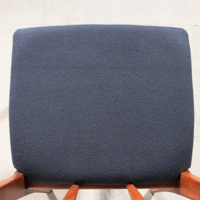 Mid-century vintage teak dining chair with dark navy fabric upholstery and clean British design.