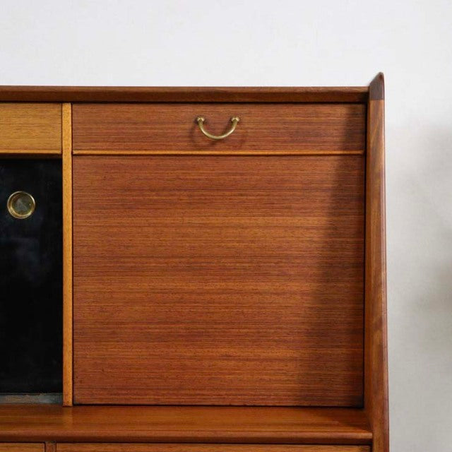 Mid-century British vintage G-Plan teak highboard with rich wood grain, brass handle, and clean lines.