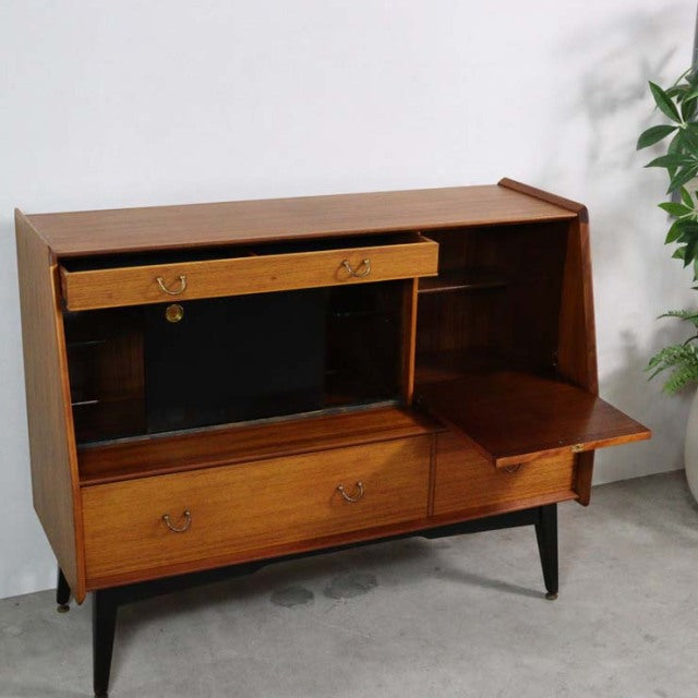 Mid-century British vintage G-Plan teak highboard with angled legs, wood grain finish, open compartment, and drop-down door.