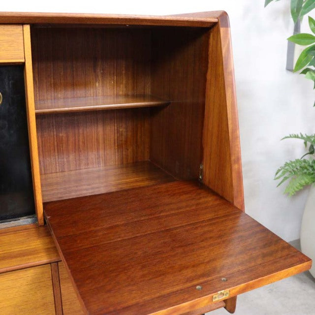Vintage mid-century teak G-Plan Librenza highboard with British design, smooth wood grain, and fold-down front panel.
