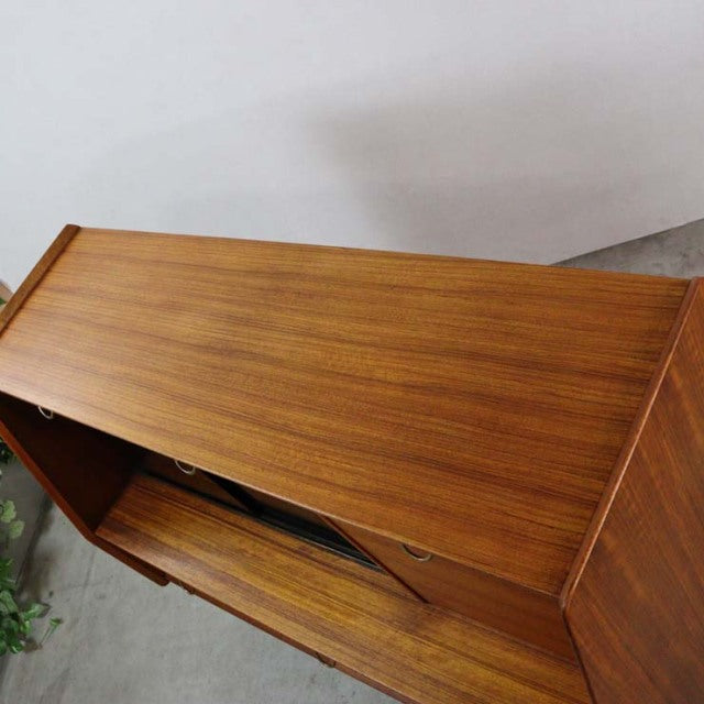 Vintage British mid-century G-Plan teak highboard with smooth wood grain and clean lines.
