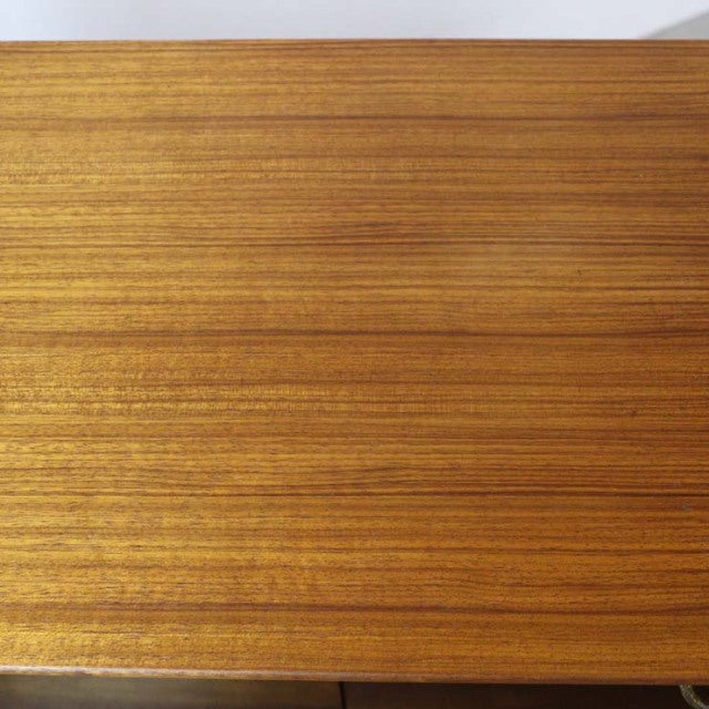 Smooth teak wood grain on vintage mid-century British G-Plan Librenza highboard top with warm honey tones.