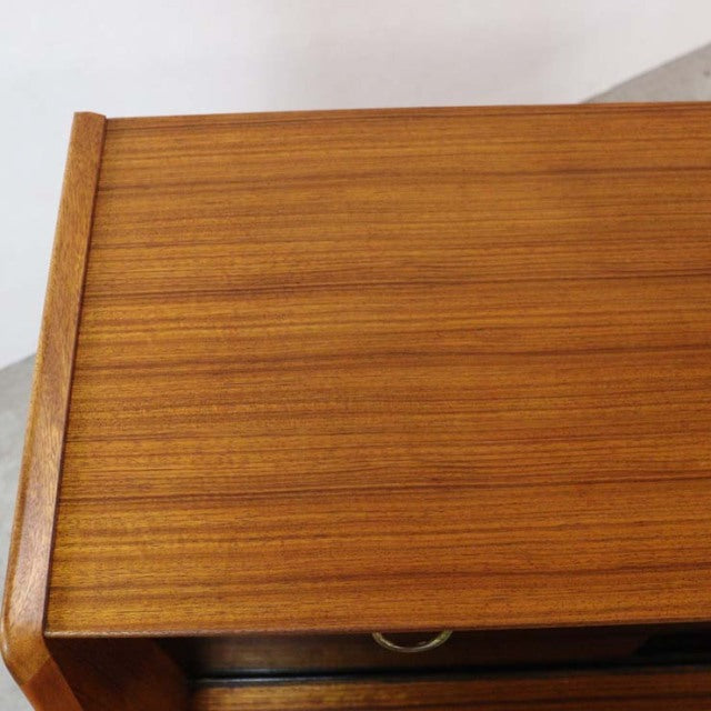 Vintage teak G-Plan mid-century highboard with smooth wood grain and rounded edges, British design.