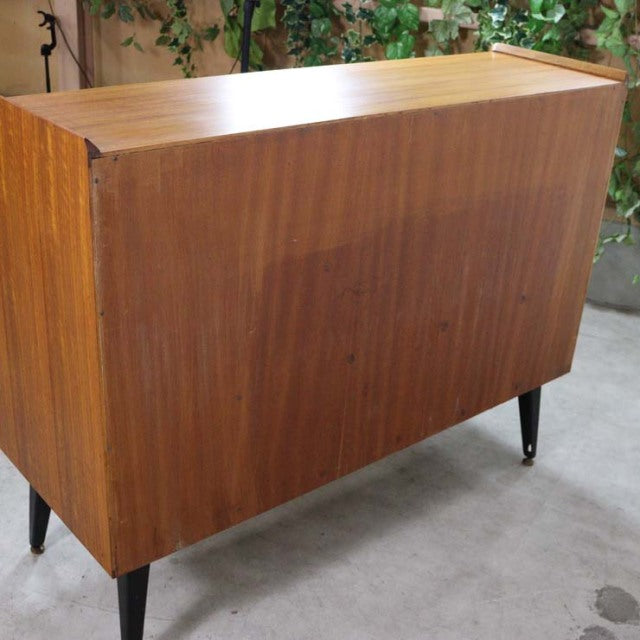 Vintage teak G-Plan mid-century British highboard with clean grain, tapered black legs, and sleek rectangular form.