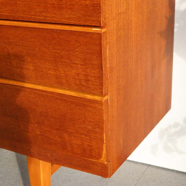 Mid-century British teak sideboard by Beautility with rich wood grain, smooth drawer fronts, and tapered legs.