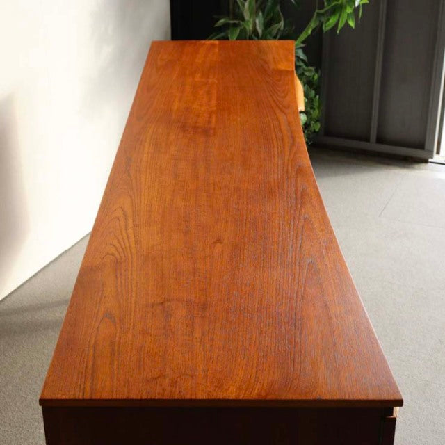 Vintage teak sideboard by Beautility with rich wood grain and tapered mid-century British legs, crafted in Denmark style.