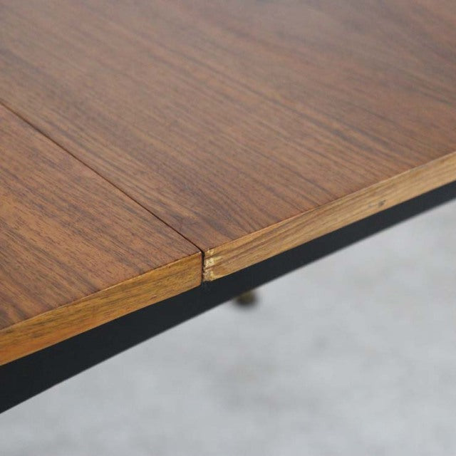 Vintage mid-century teak dining table corner with visible wood grain and seamless join, British-Denmark style.