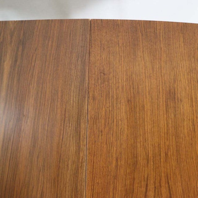 Vintage British mid-century teak dining table top showcasing rich wood grain and smooth finish.