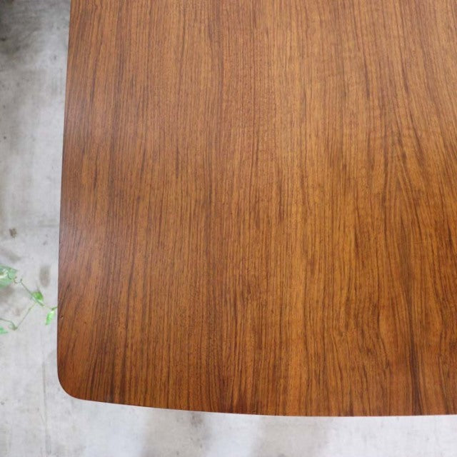 Vintage teak dining table top with warm wood grain, smooth finish, and rounded corners, mid-century British design from.