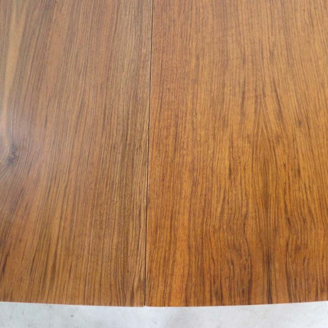 Vintage teak dining table top with rich wood grain and warm mid-century British-Denmark style finish.