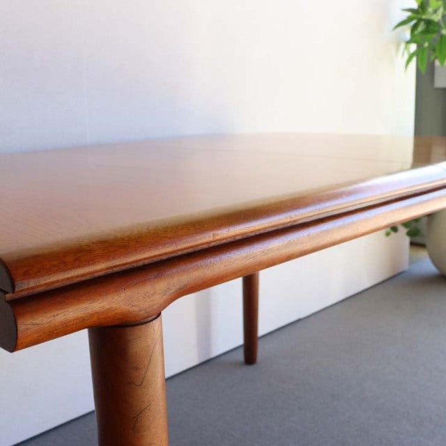 Mid-century vintage British teak dining table by WhiteANDnewton, rectangular top with rounded edges and smooth wood grain,.
