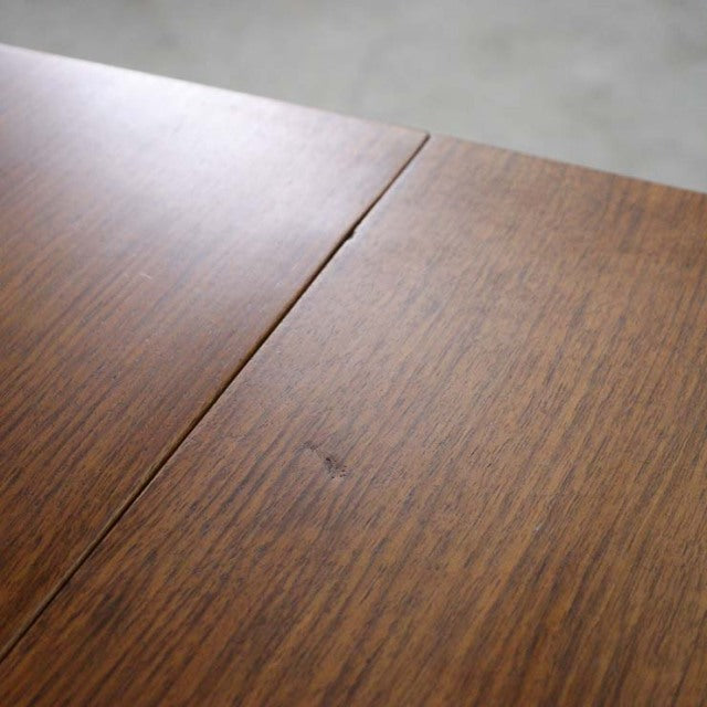 Vintage teak dining table top with rich wood grain, smooth finish, showcasing mid-century British-Denmark craftsmanship.