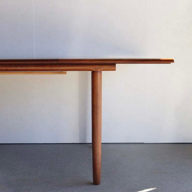 Vintage teak dining table by White AND Newton with mid-century British-Denmark design, featuring clean rectangular top and.
