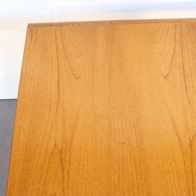 Mid-century British vintage teak dining table top with smooth wood grain and rectangular shape.