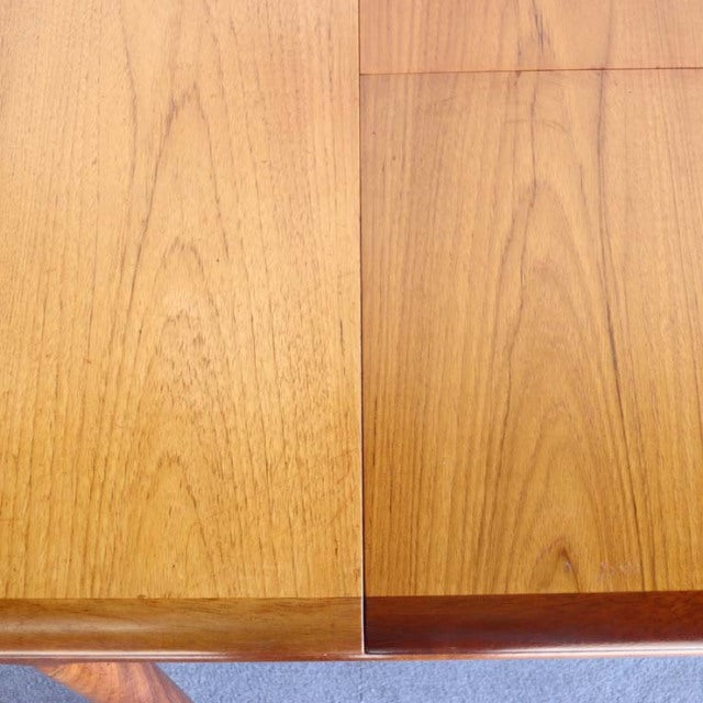 Vintage British mid-century teak dining table by White AND Newton with rectangular top and visible wood grain.