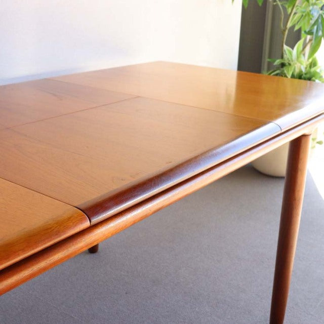 Vintage teak rectangular dining table by White AND Newton, British mid-century design with smooth wood grain and tapered.