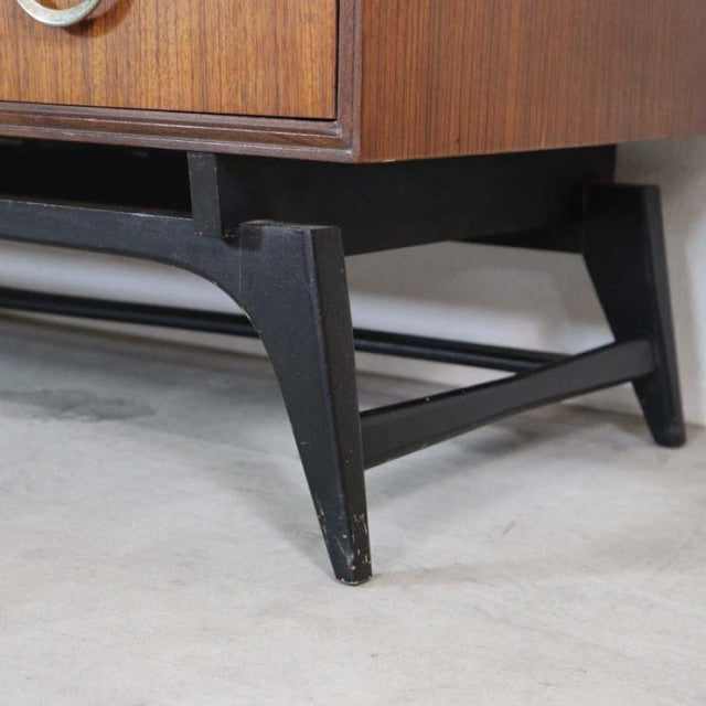 Mid-century British vintage teak chest leg with dark tapered wooden base and visible wood grain.