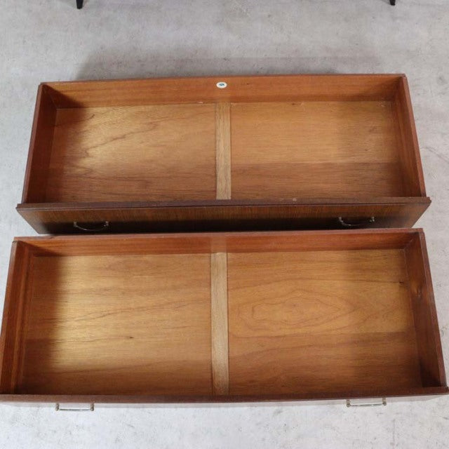 Open vintage teak drawers showing smooth wood grain and mid-century minimalist British design from Meredew.