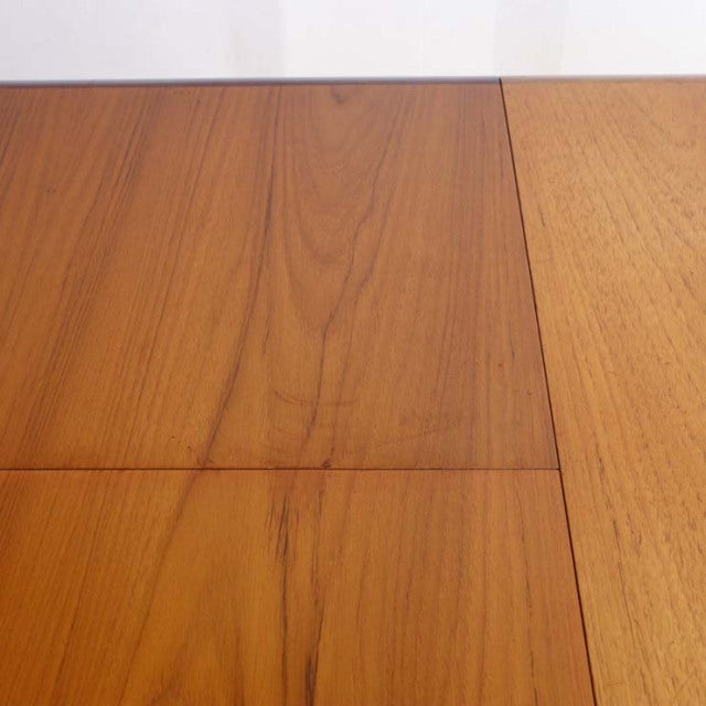 Mid-century vintage teak dining table top with smooth wood grain and rectangular panels from British brand WhiteANDnewton.