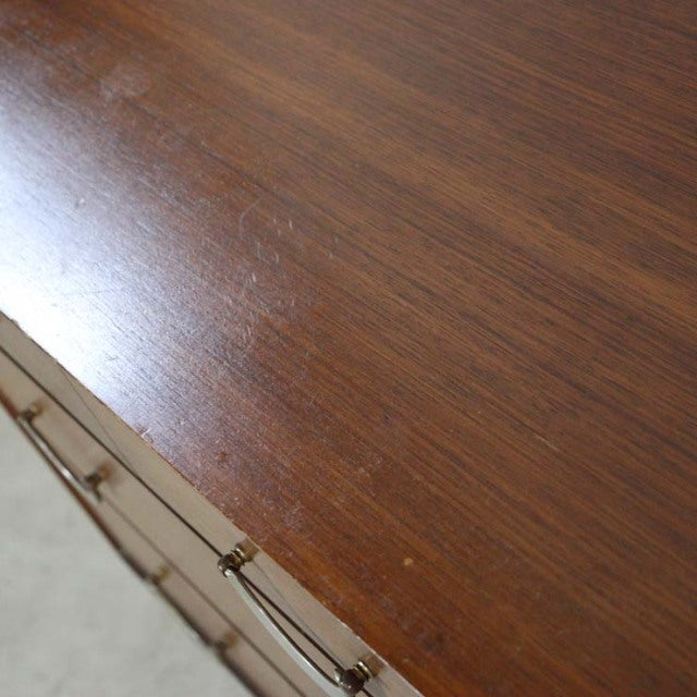 Vintage teak mid-century British chest by Meredew with smooth wood grain and brass handles.