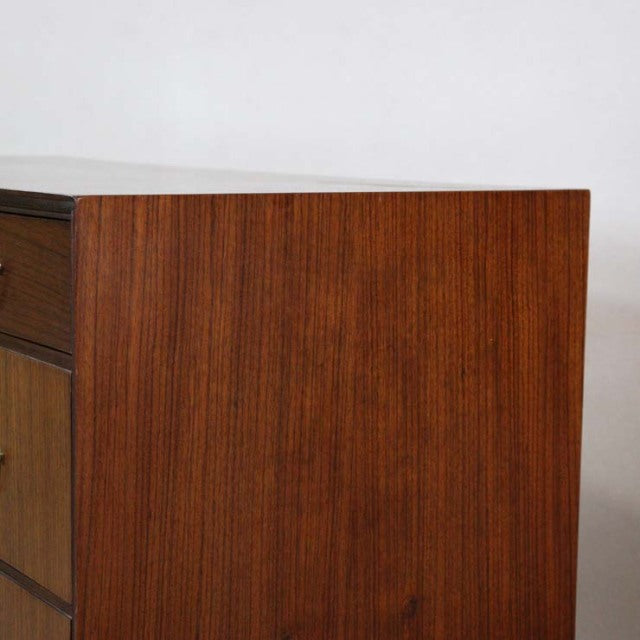 Vintage teak mid-century chest by Meredew, British brand, showcasing warm wood grain and clean lines with a smooth, polished .