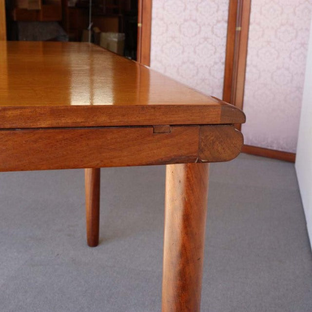 Mid-century vintage teak dining table by White and Newton with rectangular top, rounded edges, and tapered British legs.