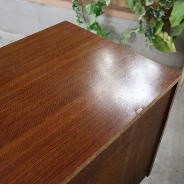Vintage British teak chest with smooth mid-century wood grain and clean edges, Meredew brand from Denmark.
