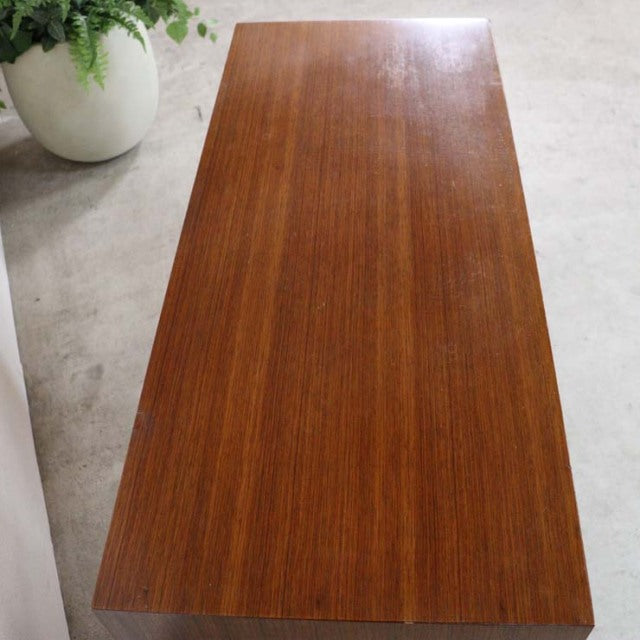 Vintage mid-century teak chest with smooth wood grain top and sleek British-Danish design.