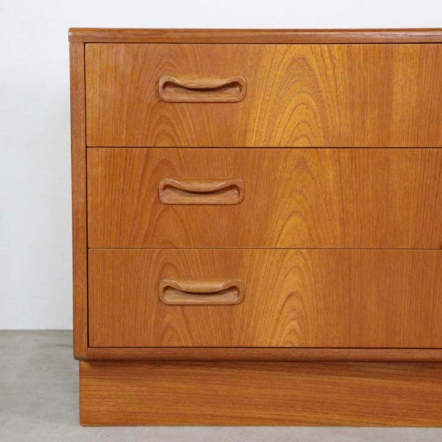 Vintage G-Plan teak mid-century 3-drawer chest with smooth wood grain and curved recessed handles, British design from.