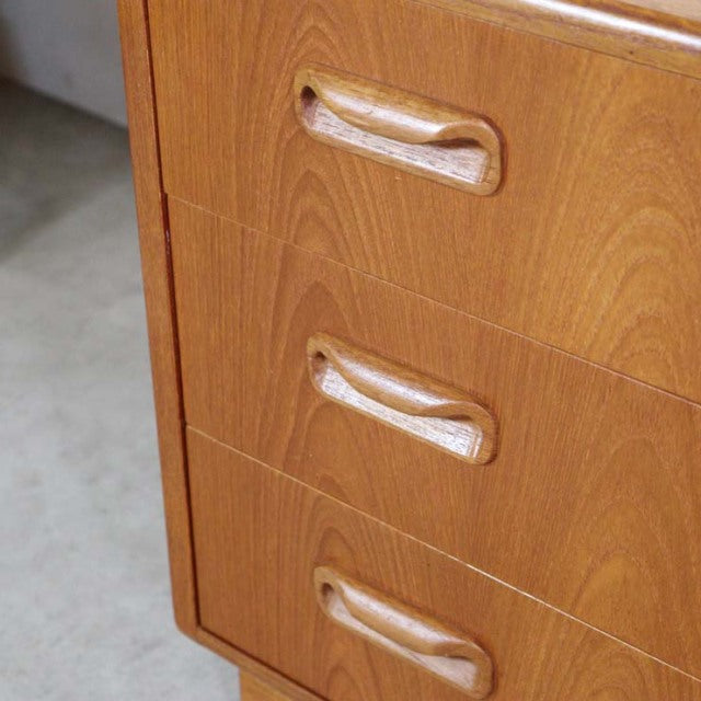 Vintage teak G-Plan mid-century British chest with three drawers and sculpted recessed handles.