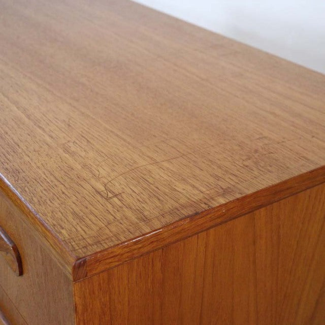 Vintage British mid-century teak G-PLAN Fresco three-drawer chest with smooth wood grain and rounded edges.