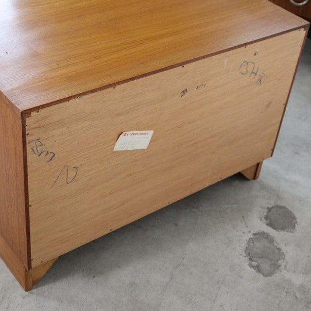 Vintage British mid-century G-PLAN Fresco teak 3-drawer chest showing rich wood grain, slender tapered legs, and rectangular .