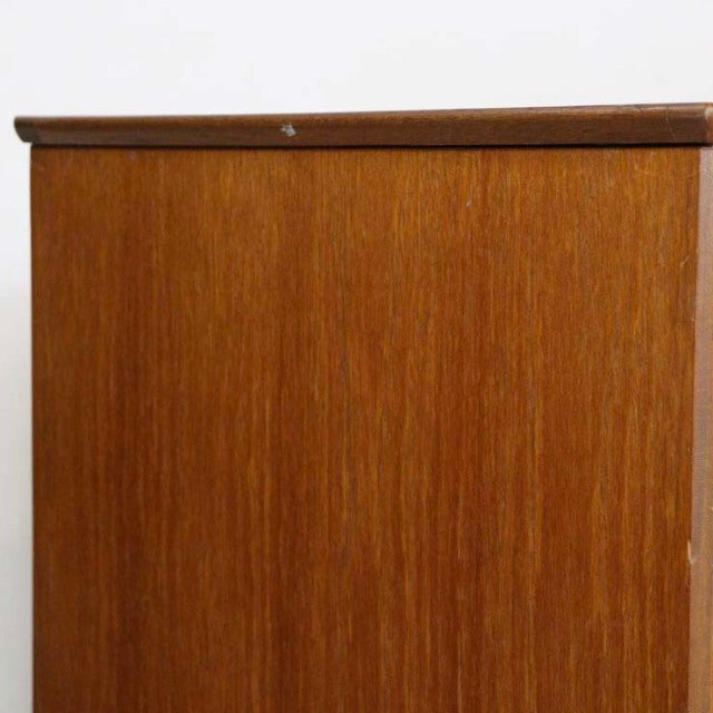 Vintage teak British mid-century sideboard with smooth wood grain and clean lines from Denmark.