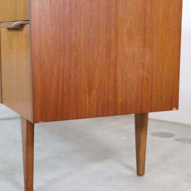 Mid-century British vintage teak sideboard with warm wood grain and tapered legs from Denmark style collection.