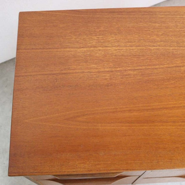Vintage teak sideboard top with smooth wood grain and warm mid-century finish.