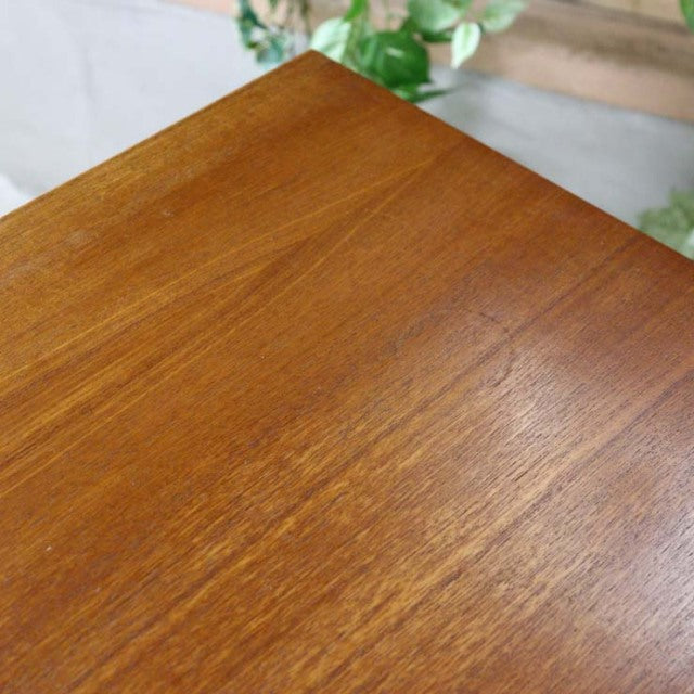 Vintage teak British mid-century sideboard top surface with smooth wood grain and warm finish.