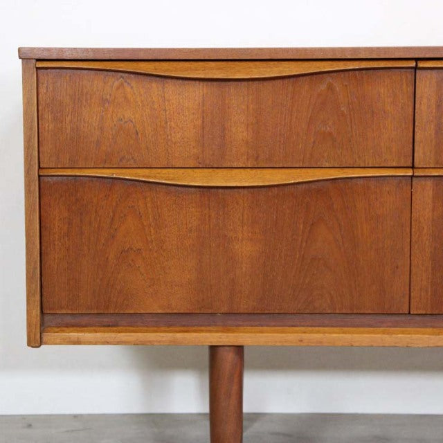 Mid-century British vintage teak sideboard by Austinsuite with smooth wood grain and rounded legs from Denmark style.