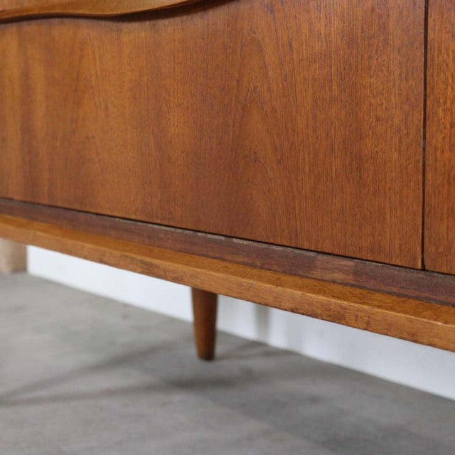 Close-up of vintage teak sideboard leg and wood grain, mid-century British design from Denmark.