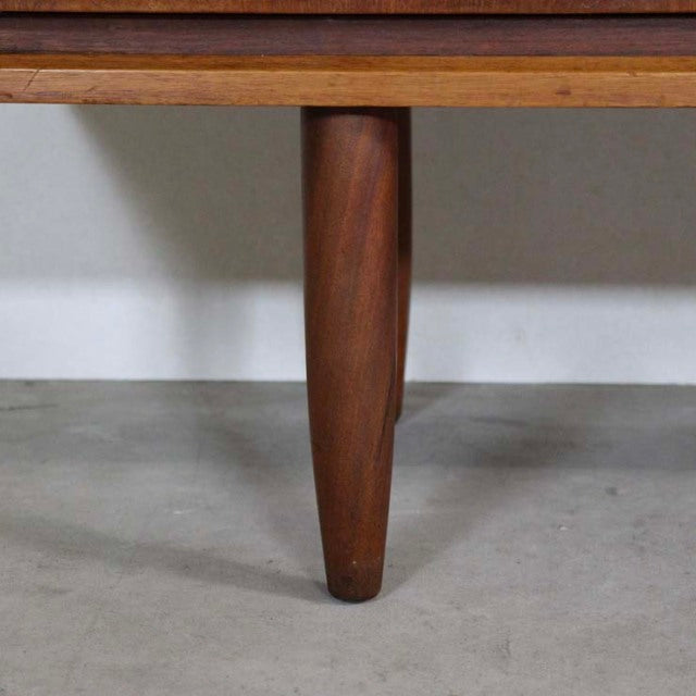 Close-up of tapered teak leg with smooth grain on British vintage mid-century Austinsuite sideboard from Denmark.
