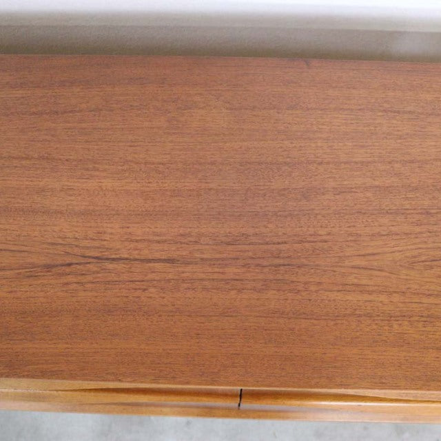 Close-up of vintage British mid-century Austinsuite teak sideboard showcasing rich wood grain and smooth finish.