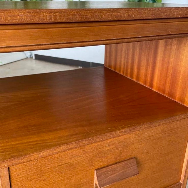 Mid-century British teak TV board with vintage iron legs, rich wood grain, and clean rectangular form.
