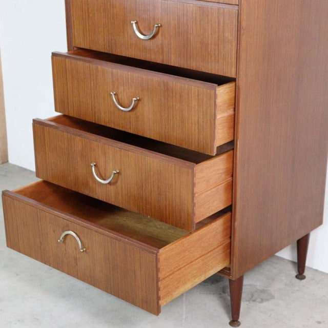 Vintage mid-century teak six-drawer chest by MEREDEW with rich wood grain and tapered British-style legs from Denmark.