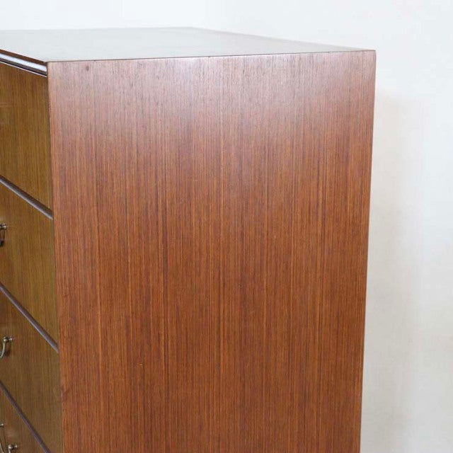 Vintage teak mid-century six-drawer chest by British brand MEREDEW with sleek wood grain and sturdy legs.