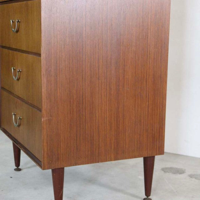 Vintage teak mid-century chest with six drawers, tapered legs, rich wood grain from British brand Meredew.