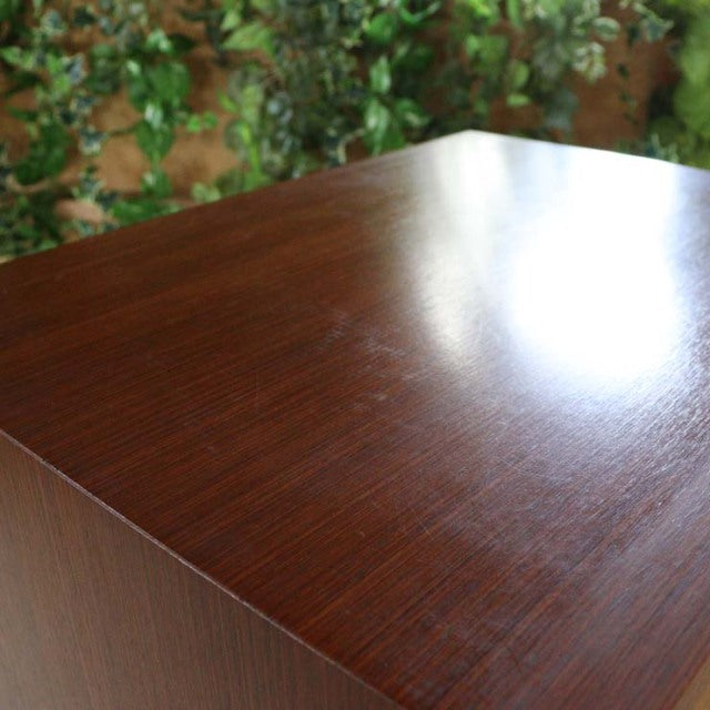Vintage teak mid-century chest top corner with rich wood grain and smooth finish, British-Denmark style.