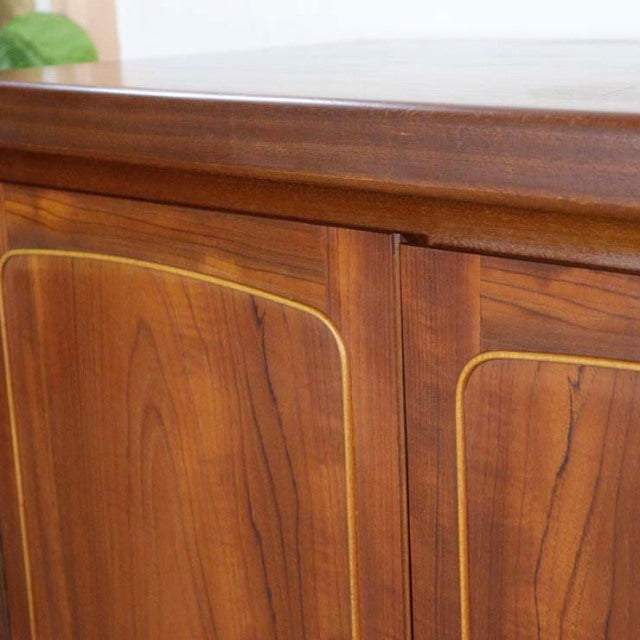Mid-century British vintage teak sideboard by Nathan with rich wood grain and rounded square panel doors.