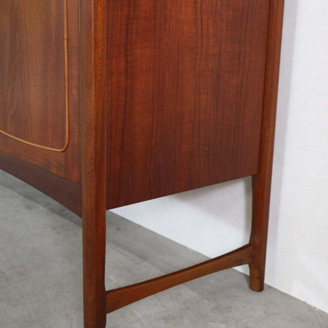Vintage teak mid-century British Nathan sideboard with warm wood grain and tapered legs from Denmark.