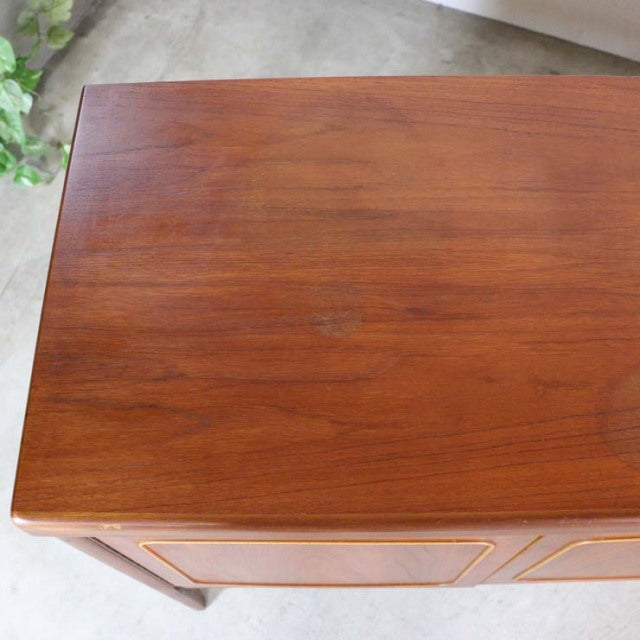 Vintage teak British mid-century sideboard by Nathan with rich wood grain and sleek square design.